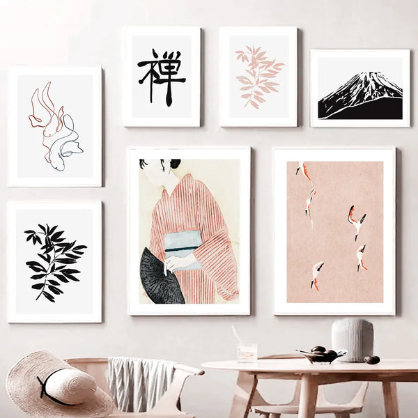 Des toiles dans les tons noir, blanc et rose sont de style peinture japonaise. Les tableaux sont dans une salle à manger avec une table et une chaise en bois moderne. 