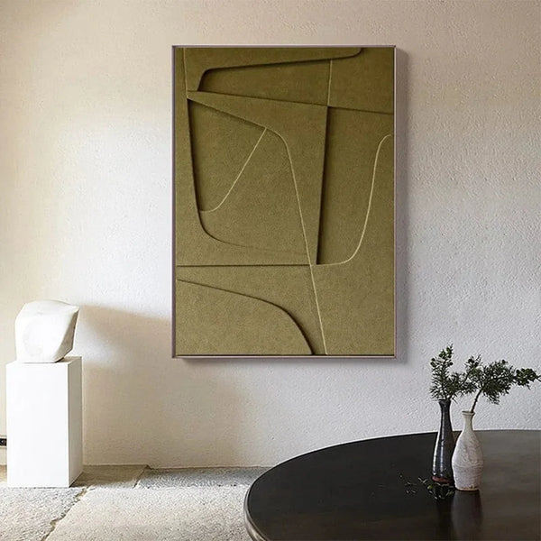 Un tableau scandinave minimaliste monochrome kaki est installée au mur. La décoration autour est épuré, minimaliste et design. 